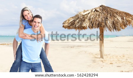 Happy couple on Punta Cana beach. Vacation.
