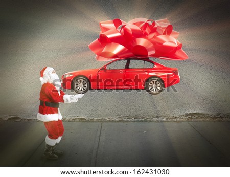 Santa claus with car gift. Christmas holiday background.