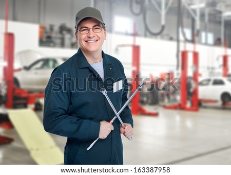 Auto mechanic with wrench Car repair service Auto mechanic with wrench Car repair service