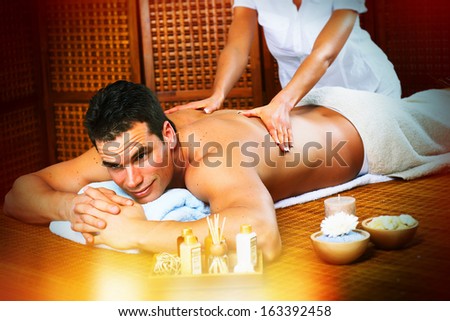 Handsome man relaxing in spa massage salon Handsome man relaxing in spa massage salon