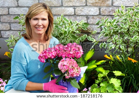 Happy senior woman in the garden. Gardening.
