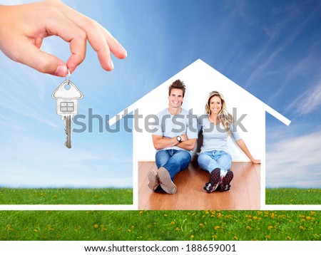 Happy family near new home. Mortgage concept.