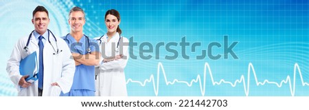 Group of medical doctors over blue hospital background. Health care