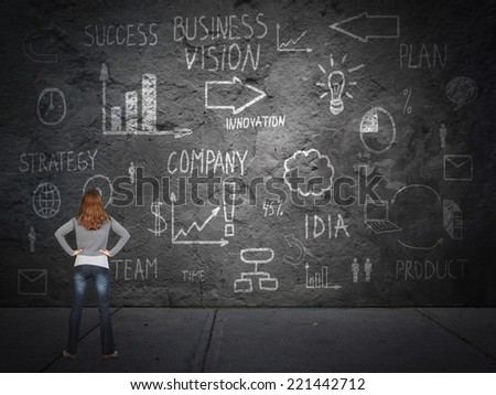 Young woman looking at innovation plan. Business strategy concept