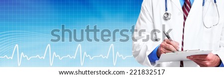Hands of medical doctor writing prescription over blue background