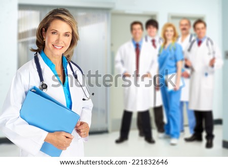 Medical doctors team over blue hospital background