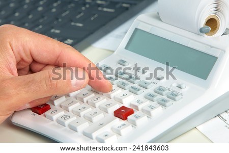 Hand of accountant man with calculator. Accounting