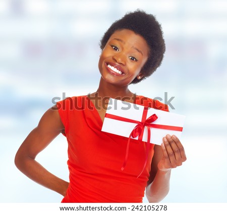 African-American girl with gift envelope. over blue background