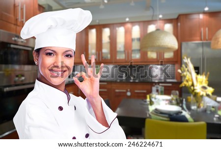 Young professional chef woman in modern kitchen