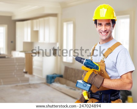 Construction worker in  new house. Renovation background.