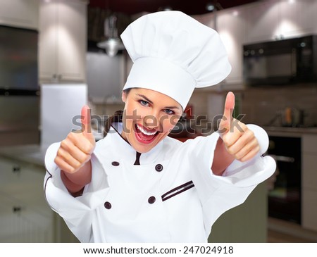 Young professional chef woman in modern kitchen