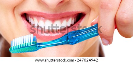 White Teeth with toothbrush. Dental health background