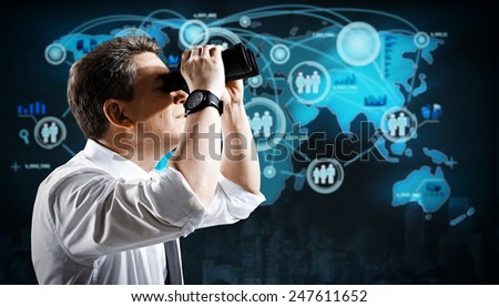 Man with binoculars Spying to business competitors.