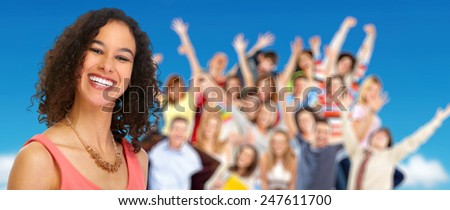 Young smiling woman and group of happy people.