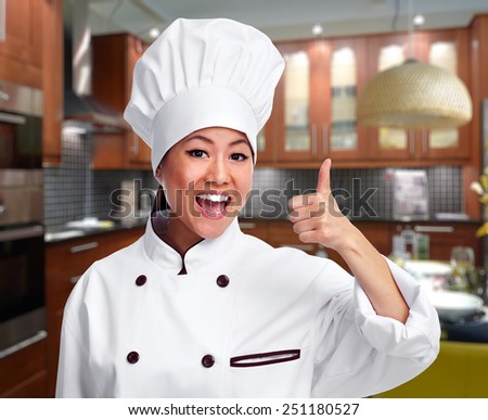 Young asian chef woman in modern kitchen