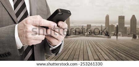 Hands of businessman with phone. Technology and communication background.