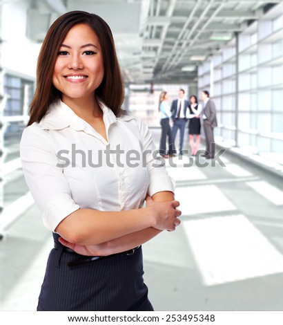 Young chinese Business woman over office background