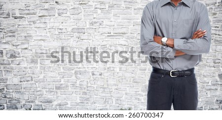 Man over grey wall background. Clothing and fashion.
