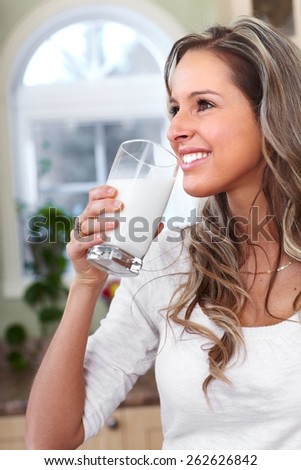 Young woman drinking milk. Health and diet.