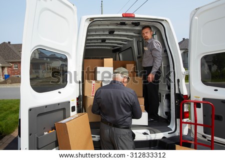 Delivery men with parcels near cargo truck. Post service.