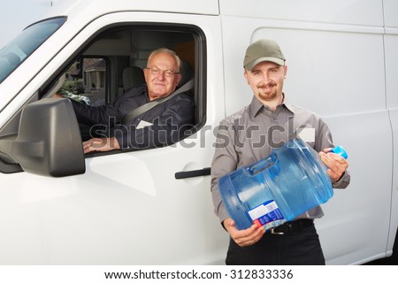 Water delivery service man with big bottle.