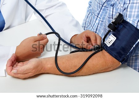 Doctor checking old man patient arterial blood pressure. Health care.