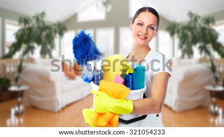 Young smiling maid. House cleaning service concept.