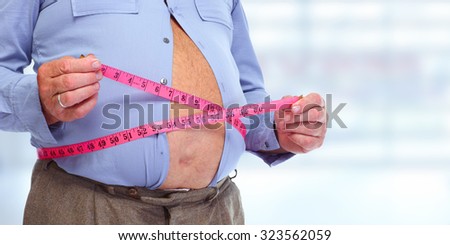 Obese man abdomen. Obesity and weight loss.