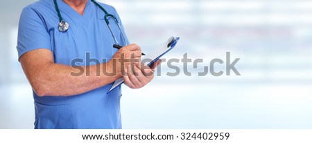 Hands of medical doctor with clipboard. Health care background.