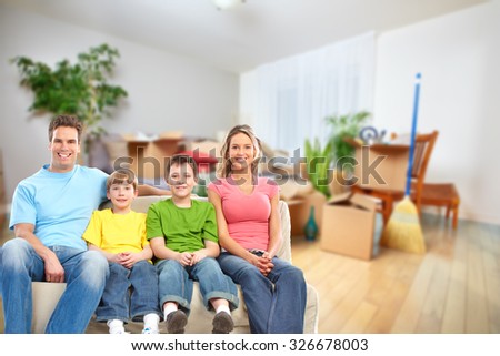 Happy family in a new house. Real estate and moving background.