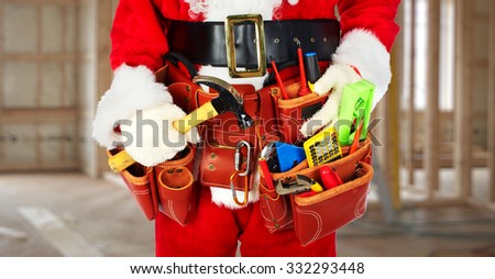 Santa Worker with a tool belt construction background.