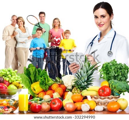 Doctor with vegetables and family. Healthy diet and nutrition.