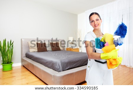 Maid woman with tools. House cleaning service concept.