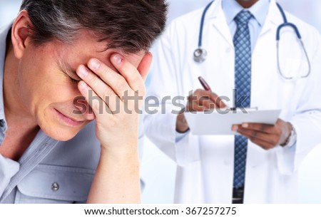 Man having a migraine headache.