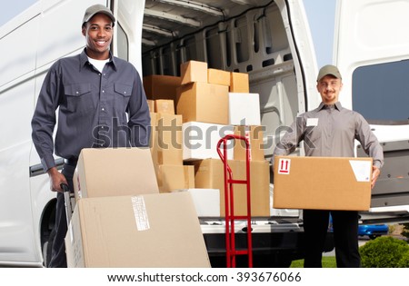 Delivery man near shipping truck.