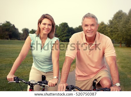 Senior couple with bicycle.