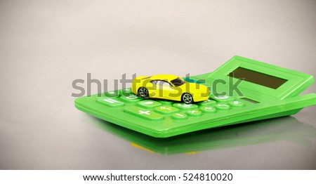 Yellow car and calculator.