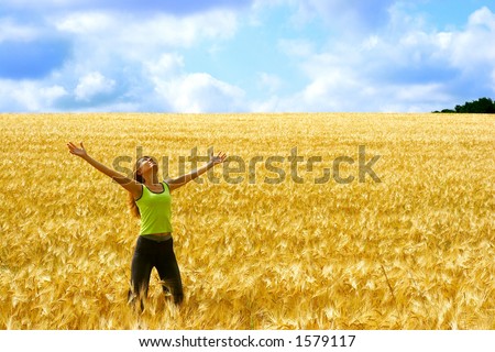 Happy young woman in the field