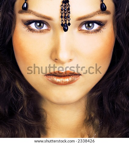 stock photo Mysterious eastern pretty woman with beautiful eyes