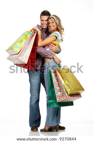 Shopping  couple  smiling. Isolated over white background