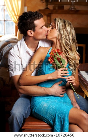 http://image.shutterstock.com/display_pic_with_logo/55550/55550,1206410729,2/stock-photo-young-love-couple-kissing-in-the-comfortable-apartment-10720450.jpg