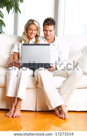 Young love couple smiling in the comfortable apartment