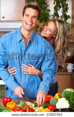 Young love couple cooking in the kitchen