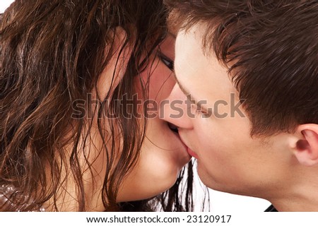 Young couple in love kissing.  Over white background
