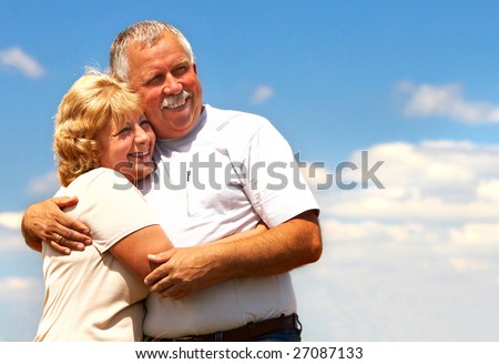 Smiling happy elderly couple in love outdoor