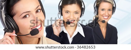 Smiling  business women  with headsets in the office