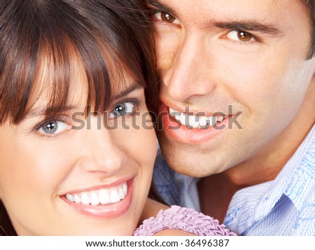 Happy smiling couple in love. Over white background