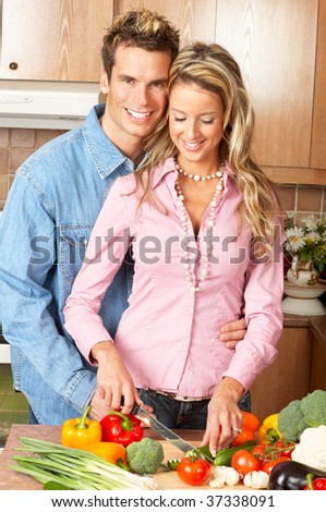 Young love couple cooking in the kitchen