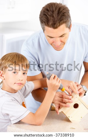 Happy family. Father and son working at home
