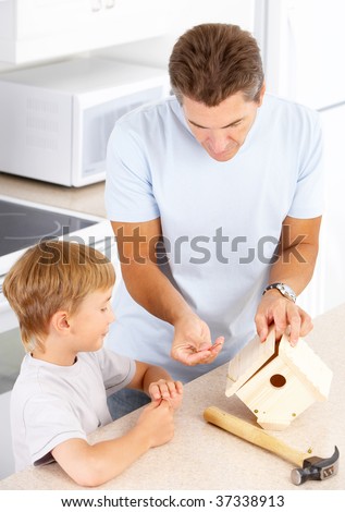 Happy family. Father and son working at home